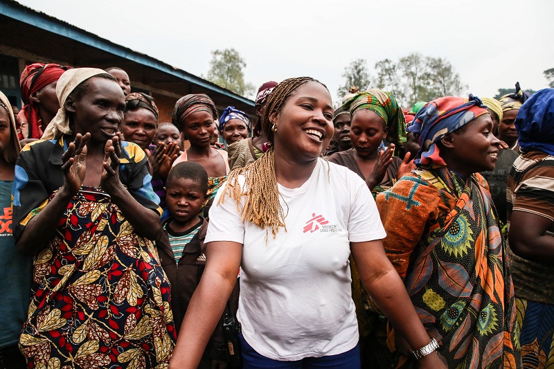 Sifa Banzira Clementine, MSF mental health supervisor, during a theatre and dance performance outside of Mweso school. Photo: Sara Creta/MSF