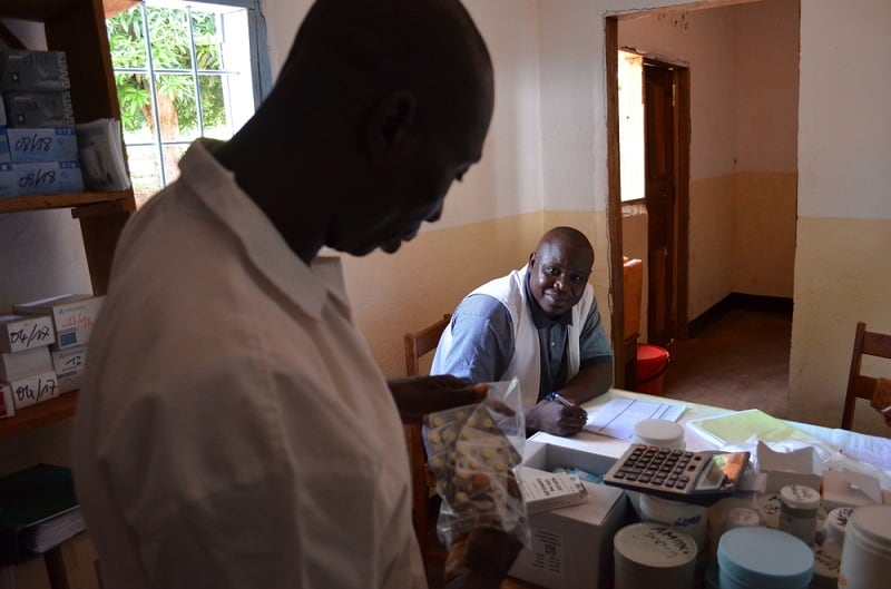 Nurse Pélé (left) and a pharmacist in Mbalazime health centre carry out an inventory of the latest MSF supply delivery. Photo: Sandra Smiley/MSF