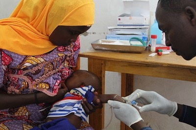 Eight-week-old Mohamed Zakari receives his first dose of the oral rotavirus vaccine (or the placebo). Photo: Séverine Bonnet/MSF
