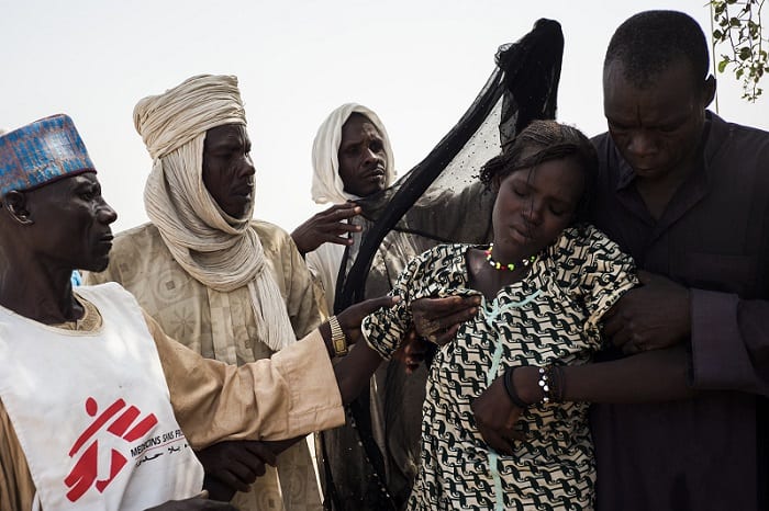 A young woman, from a camp for internally displaced people in Yakoua town, is carried after travelling more than 30km on a horse and cart to reach the MSF mobile clinic near Bol, Chad.