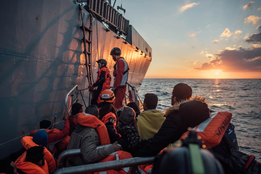MSF and SOS Mediterannee personnel from the vessel, Aquarius, rescuing refugees and migrants from an overcrowded wooden boat in the Mediterranean Sea. 