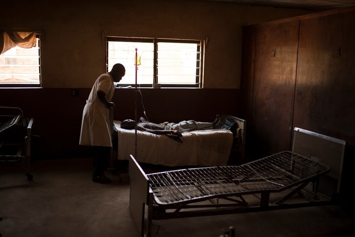 A doctor looks over a patient in the MSF-supported Baptist Medical Centre in Ippy, Central African Republic.
