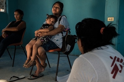 A woman rests with her granddaughter during an MSF support session for women in the Tenosique migrant shelter. Photo: Marta Soszynska/MSF