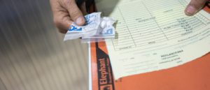 A patient holds their medicines at the MSF Hepatitis C clinic at Preah Kossamak Hospital in Phnom Penh, Cambodia.Photo: Todd Brown