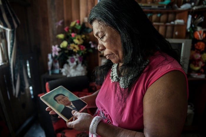 Francisca, 77, looks at a picture of her son who died six years ago in the Brisas del Mar district of Buenaventura, Colombia. She has been living in the neighbourhood for 32 years. Buenaventura is situated on the Colombian Pacific coast. It has gained notoriety as a city with the highest crime rates in the country, where a large part of the population is exposed daily to acts of violence, including killings, shootings, extortion, kidnappings and sexual abuse.