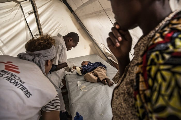 MSF nurses examine a child in the cholera treatment centre in Katana, Democratic Republic of Congo.