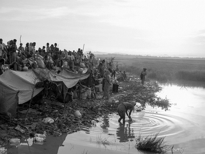 Rohingya refugees from Myanmar gather on the Bangladeshi side of the Naf River waiting for permission to continue their journey to the refugee camps near Cox's Bazar.