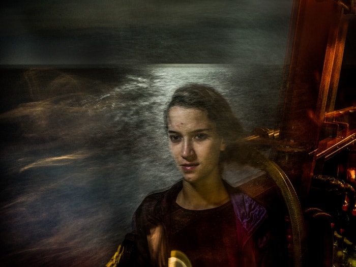 Omayma, 21, from Morocco, photographed in international waters, mid-way between Libya and Italy, in the Mediterranean Sea. From the series 'The Crossing'.