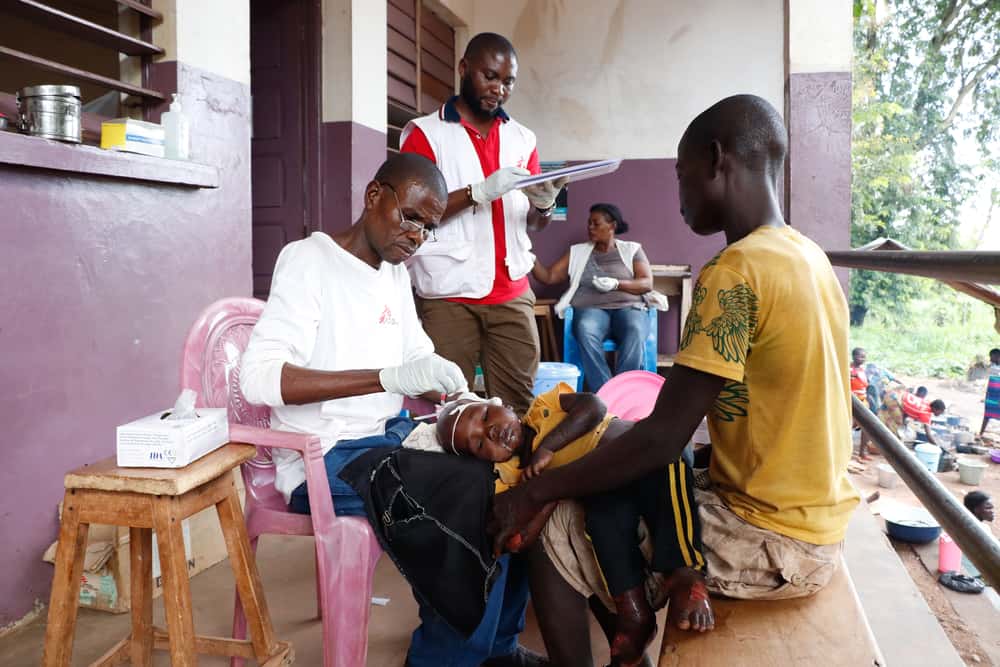 Parfait Dosséli, is the nurse supervisor at Bossangoa’s hospital and he is working in the nutrition department. He is pictured here giving intravenous treatment to baby François, a child suffering from a form of malnutrition called kwashiorkor. Photo: Elisa Fourt/MSF