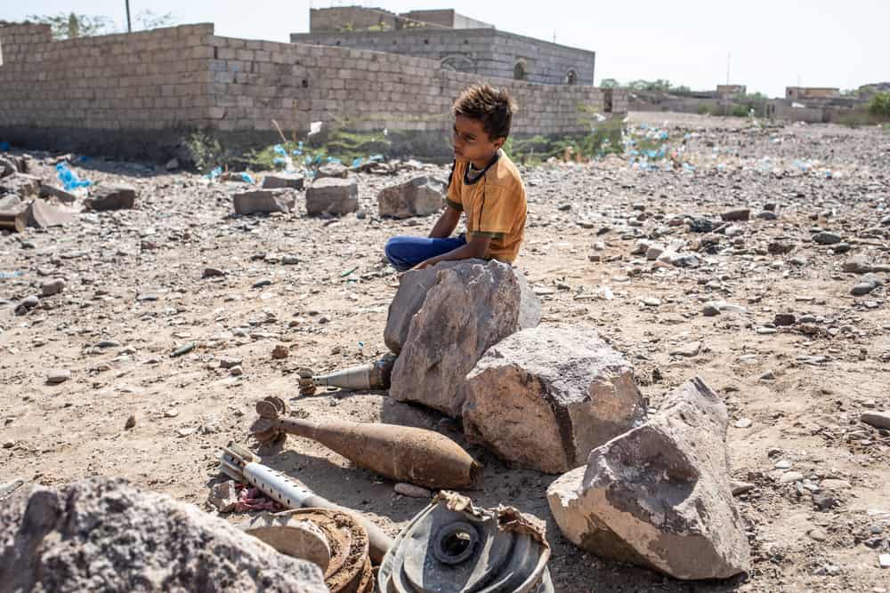 13 December 2018: A child sitting near defused rockets in Mawza, a rural area to the east of Mocha city, in Yemen's Taiz governorate. AGNES VARRAINE-LECA/MSF