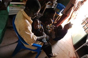 A child with malaria sleeps after receiving an IV in Kinkondja, Katanga province, DRC. April, 2012. © Sandra Smiley/MSF