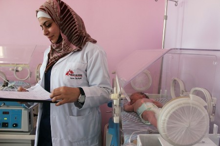 Newborn Syrian baby Zain Al-Abideen receives care from an MSF nurse in the neonatal unit at the mother and child hospital in Irbid, Jordan. &copy; Enass Abu Khalaf-Tuffaha/MSF