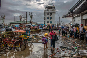 Survivors hoping to be evacuated gather at the airport in Tacloban city. Philippines 2013 © Yann Libessart/MSF