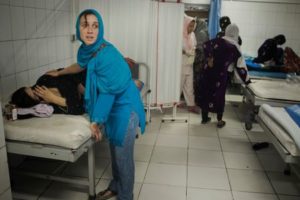 Women going through labor are helped by midwives at the Ahmed Shah Baba Hospital in Kabul, Afghanistan © Andrea Bruce/Noor Images