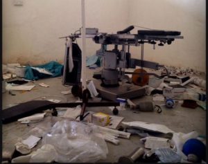 A damaged and stripped operating table in the ransacked surgical theater. Photo: Michael Goldfarb