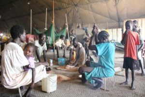Inside the UN Protection for Civilians site, where nearly 48,000 people are sheltering from the conflict, violence and malnutrition. These residents occupy an old warehouse, waiting for more suitable shelter. Photo: Jacob Kuehn/MSF