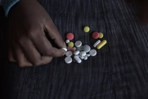 A patient at Lizo Nobanda TB Care Center in Khayelitsha township takes her pills. South Africa 2011 © Jose Cendon