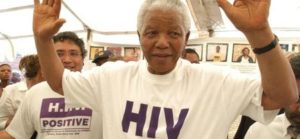 Showing solidarity: Nelson Mandela donned an HIV-Positive T-shirt during a visit to MSF’s HIV programme in Khayelitsha in December 2002. Hamba kahle Tata Nelson Mandela ©Eric Miller