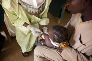 A child is vaccinated for measles during a previous vaccination campaign in Kebbi, northwest Nigeria. Nigeria 2010 © Olga Overbeek