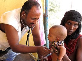 An MSF staff member examines a young patient in Afar. Ethiopia 2013 © Faith Schwieker-Miyandazi/MSF