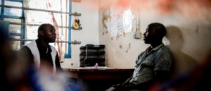 Counsellor Floribert Nzaituriki Nabonibo, conducts a psychosocial consultation with psychiatric patient Fabien Banjanga, at Mweso General Hospital on the border between the Masisi and Rutshuru territories in North Kivu, Democratic Republic of the Congo. Photo: Sara Creta/MSF