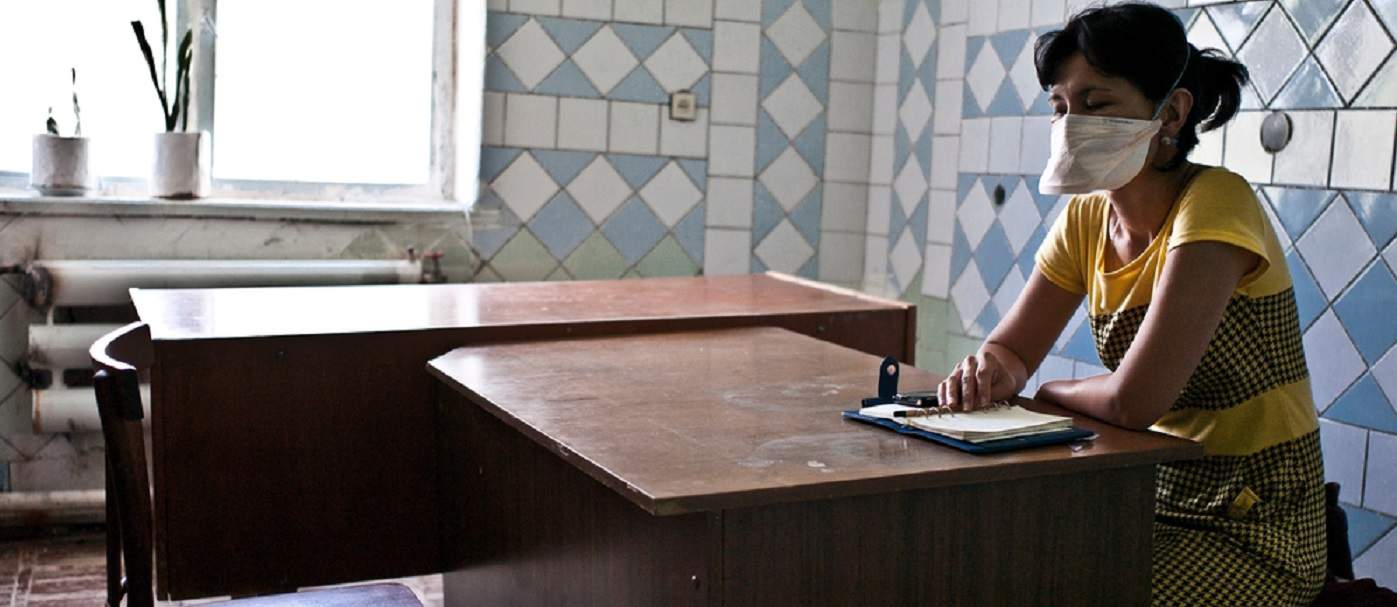 A psycho-social support counsellor from MSF  waiting for an MDR-TB patient in a local polyclinic. Patients in the ambulatory phase of their treatment come here daily to receive their medication and counselling support if needed. This is crucial, as nasty side-effects, as well as social circumstances, make it difficult for patients to complete their treatment without support. Photo: Misha Friedman