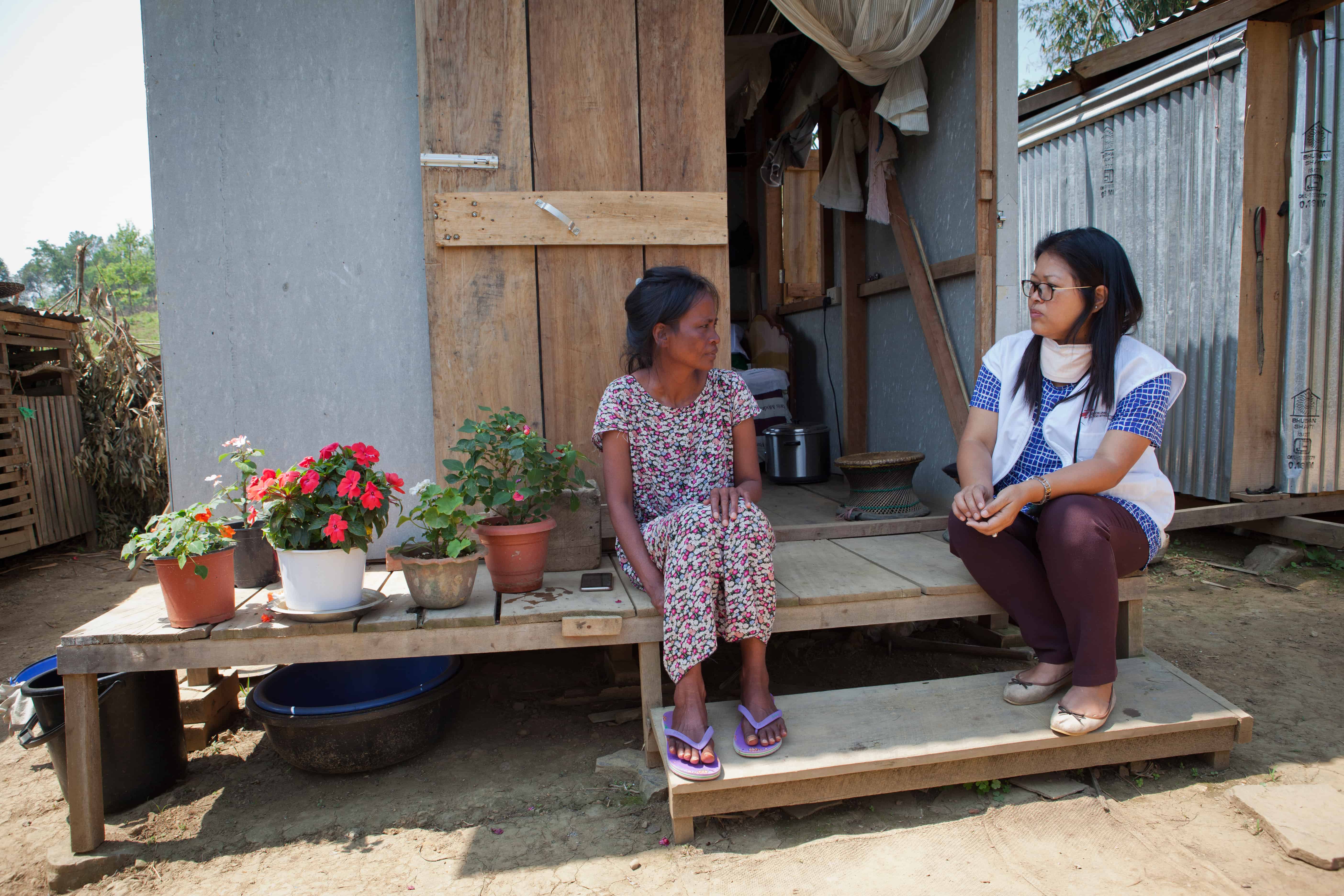 Neilam Synrem, who is receiving treatment for MDR-TB, talks to an MSF counsellor in front of the house MSF built for her next to her family home, in order to reduce the chances of transmission of the disease to the rest of her family. Manipur, India, April 2019.
© JAN-JOSEPH STOK