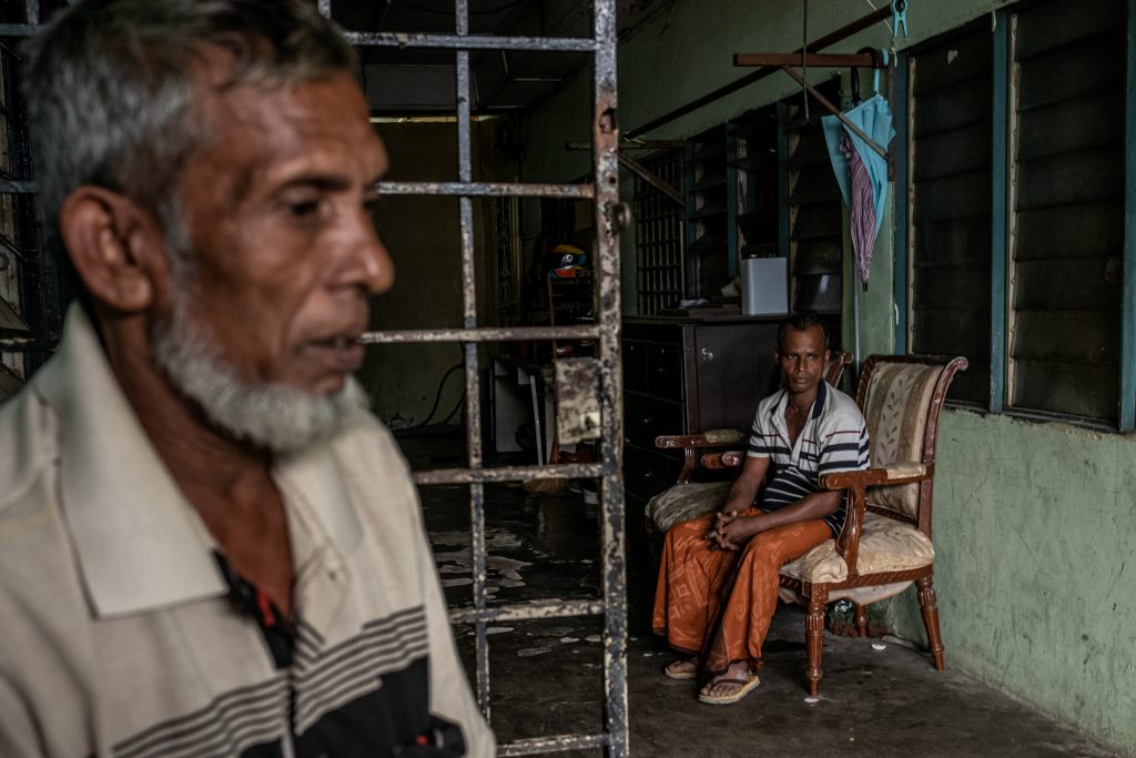 A Rohingya family in the dilapidated building where they live, in Puchong district near Kuala Lumpur, Malaysia. April 2019. © ARNAUD FINISTRE