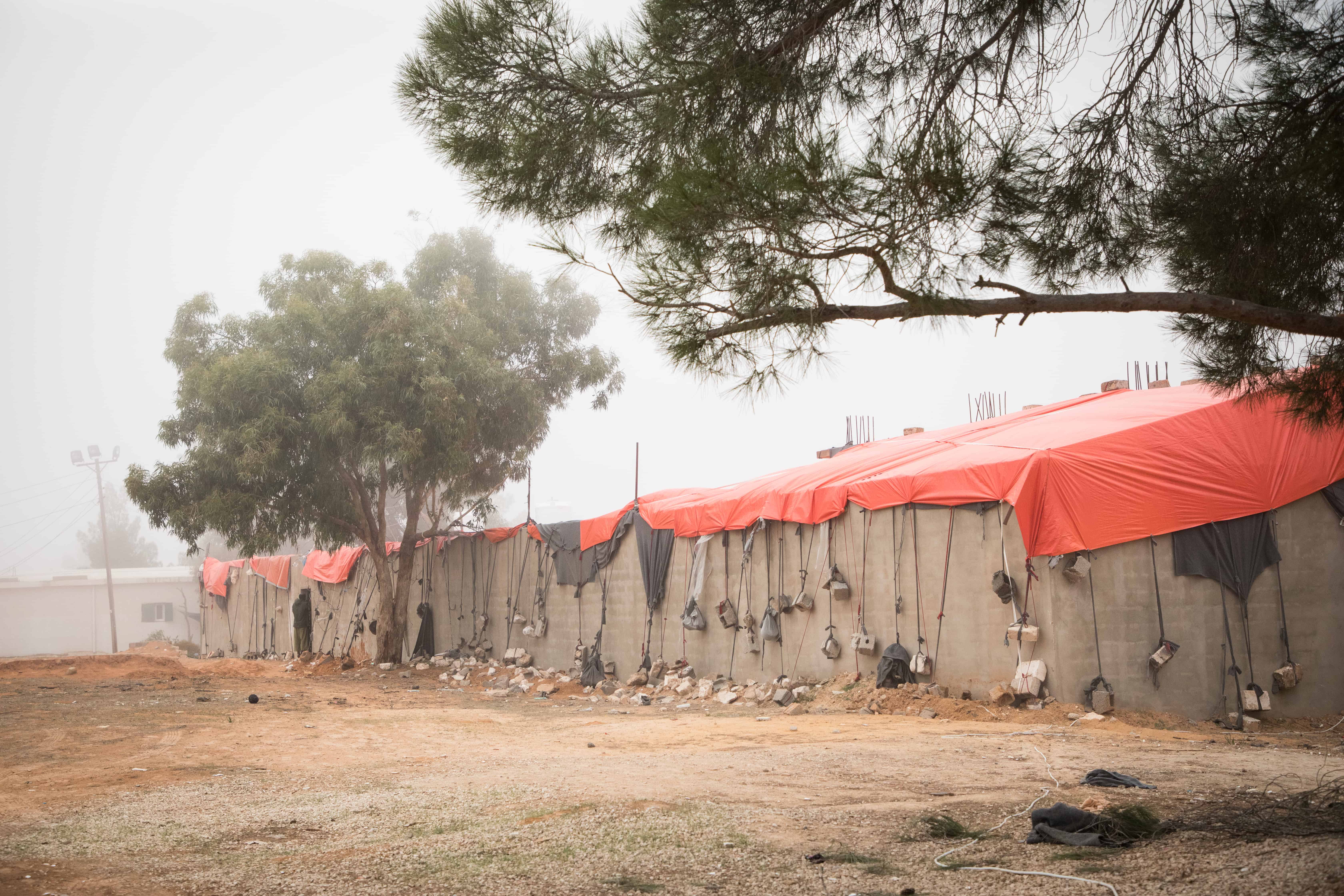Tents that form part of the Dahr-el-Jebel detention centre, located in a mountainous region south of Tripoli. When MSF began working there in May 2019, we were horrified to discover that at least 22 migrants and refugees had died of diseases, mainly tuberculosis. IOM and UNHCR were supposed to provide assistance, including medical care and protection services. Libya, October 2019. © AURELIE BAUMEL/MSF