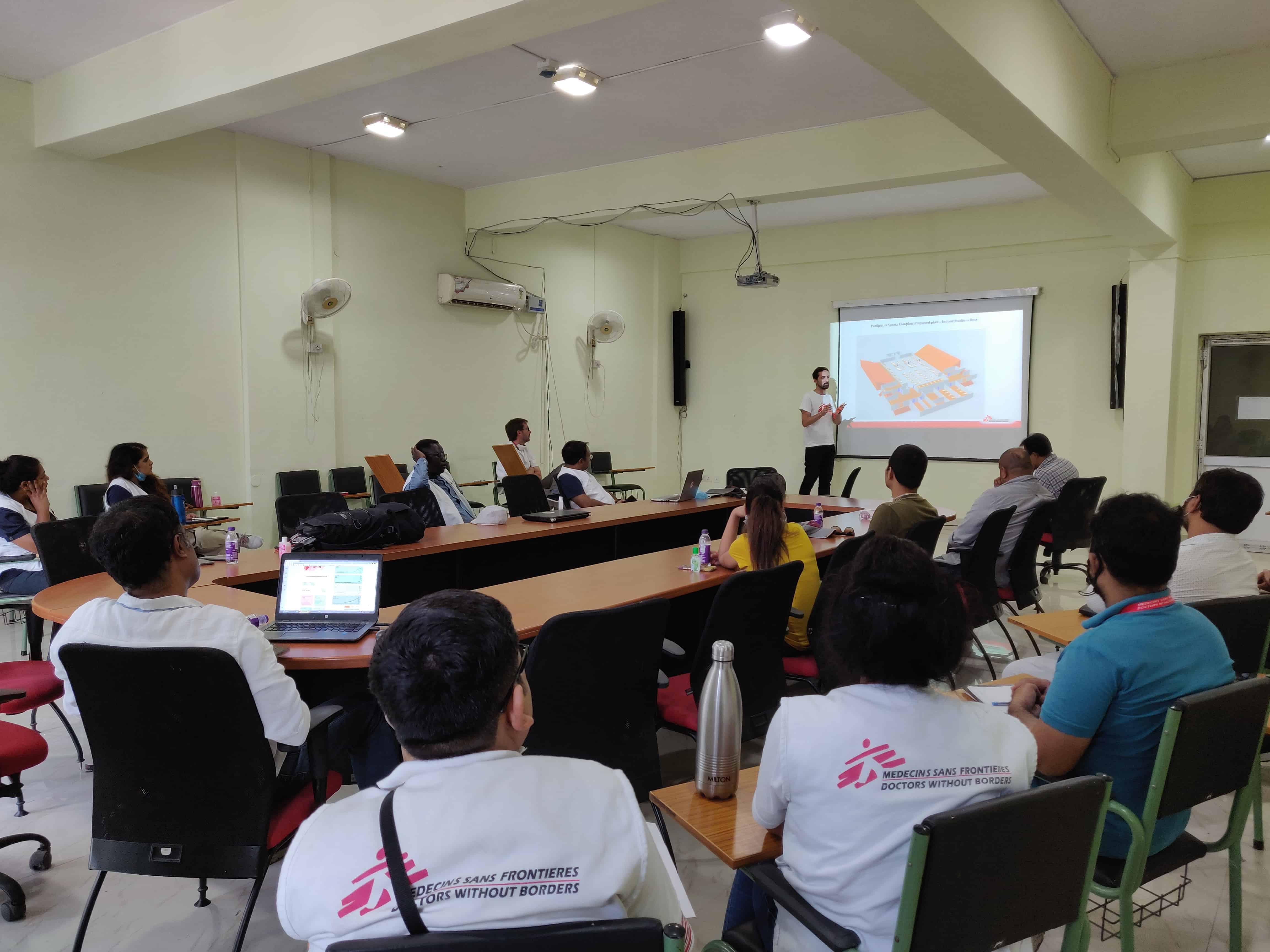Extensive planning and discussion goes into setting up a treatment unit. Each day, MSF team members brainstorm over patient flow, infection, prevention control, water and sanitation and other aspects that are crucial to the functioning of the treatment facility. ©MSF