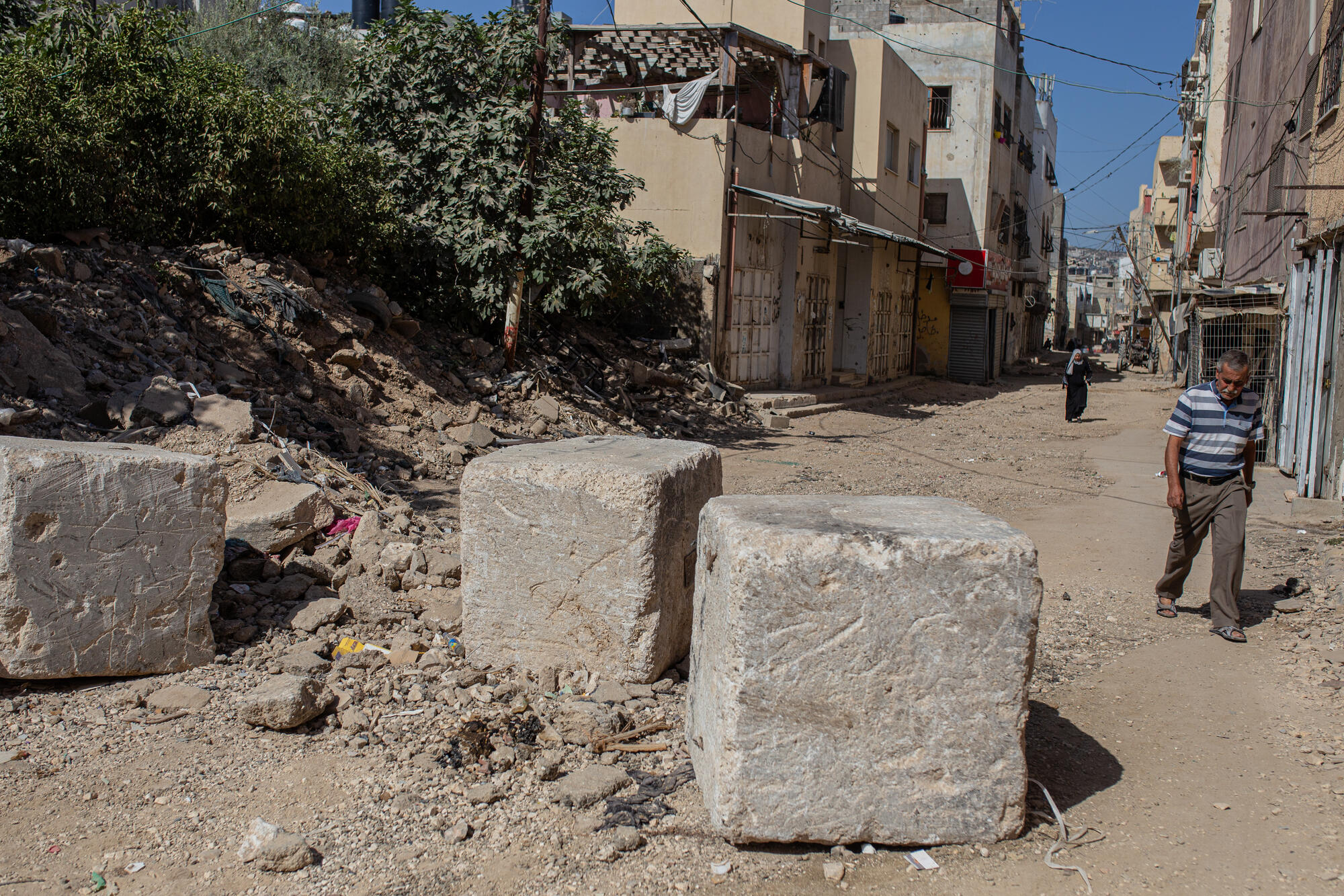 Residents in the camp have placed rocks at the entrance of the camp to dissuade Israeli forces to enter. However, as explained by a resident, Israeli bulldozers forcibly enter the camp and destroy everything in their path.