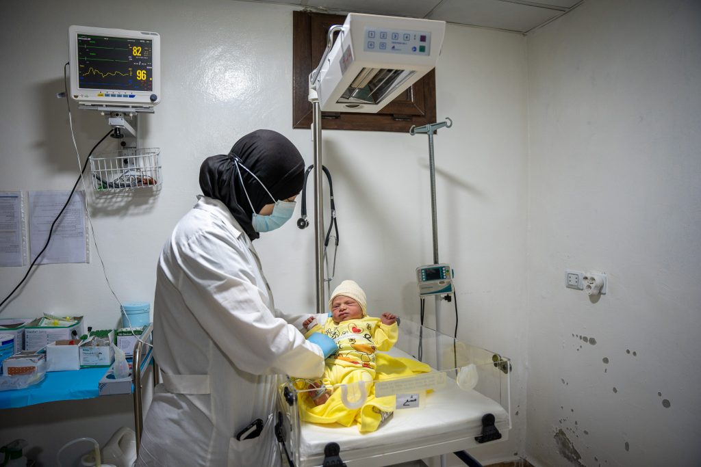 Eman, MSF nurse at Marée maternity hospital checks on a newborn in the neonatal unit of the hospital. 

Northwest Syria, July 2024.