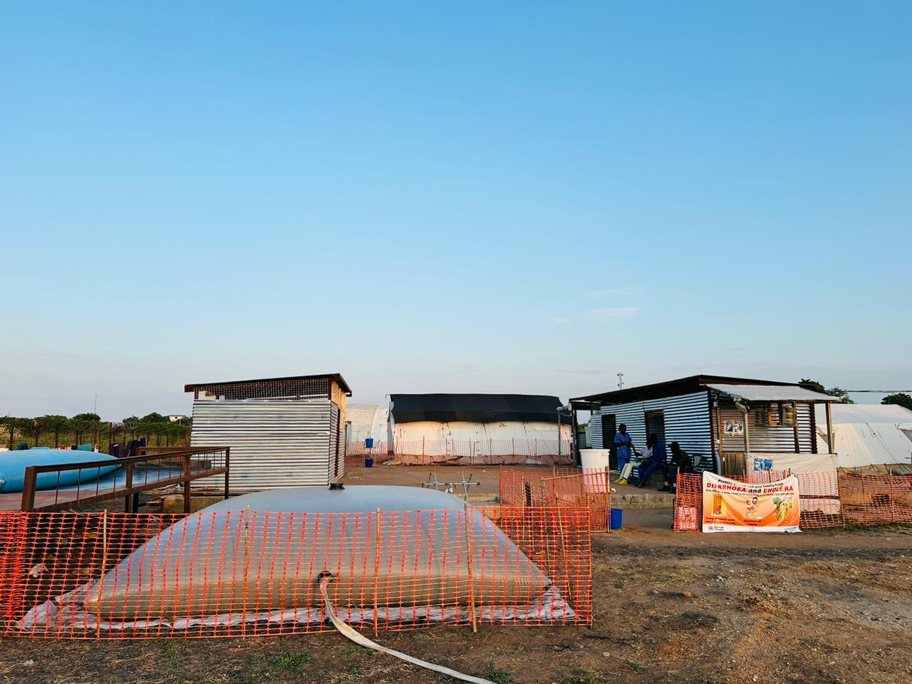 The exterior of the Cholera Treatment Unit (CTU) at Renk Civil Hospital, equipped with essential water bladders to ensure clean and safe water. MSF has set up this 20-bed facility to respond rapidly to the cholera outbreak, with plans to expand to 40 beds if needed.