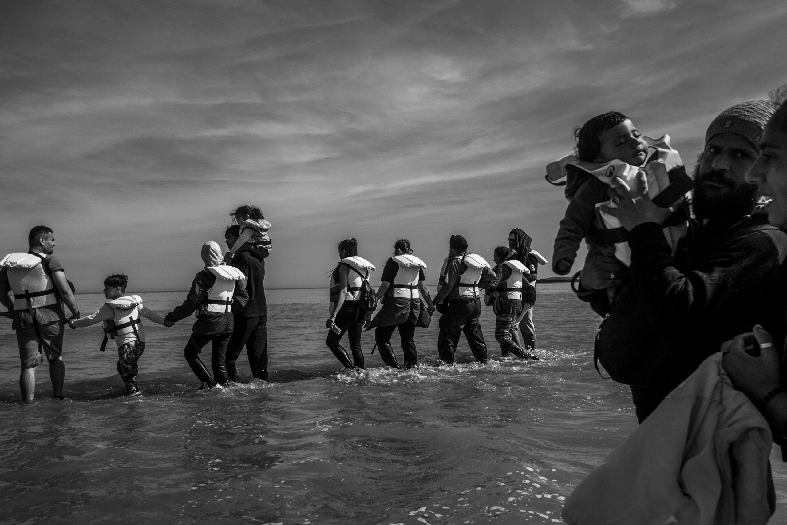Ten years after the Calais ‘Jungle’, thousands of people seeking refuge remain trapped at the France-UK border